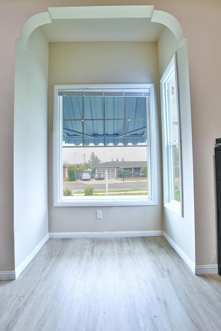 5121 Bucknall Road San Jose, CA 95130 - Photo 24 of 26 an empty room with wooden floor and a window
