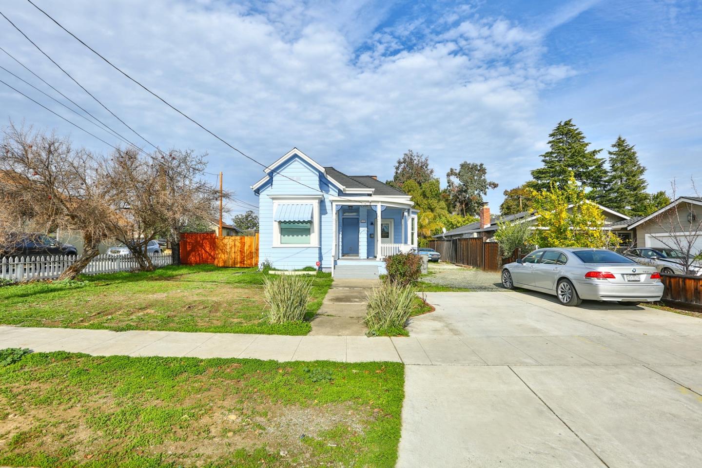 5121 Bucknall Road San Jose, CA 95130 - Photo 5 of 26 a view of a house with a yard and pathway
