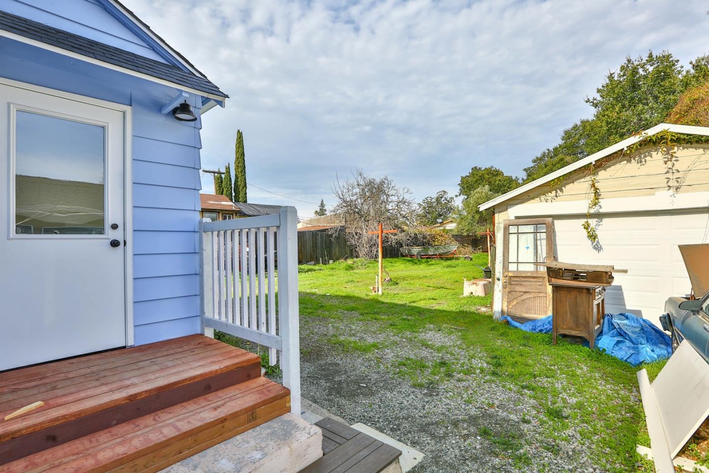 5121 Bucknall Road San Jose, CA 95130 - Photo 7 of 26 a view of a house with backyard and sitting area