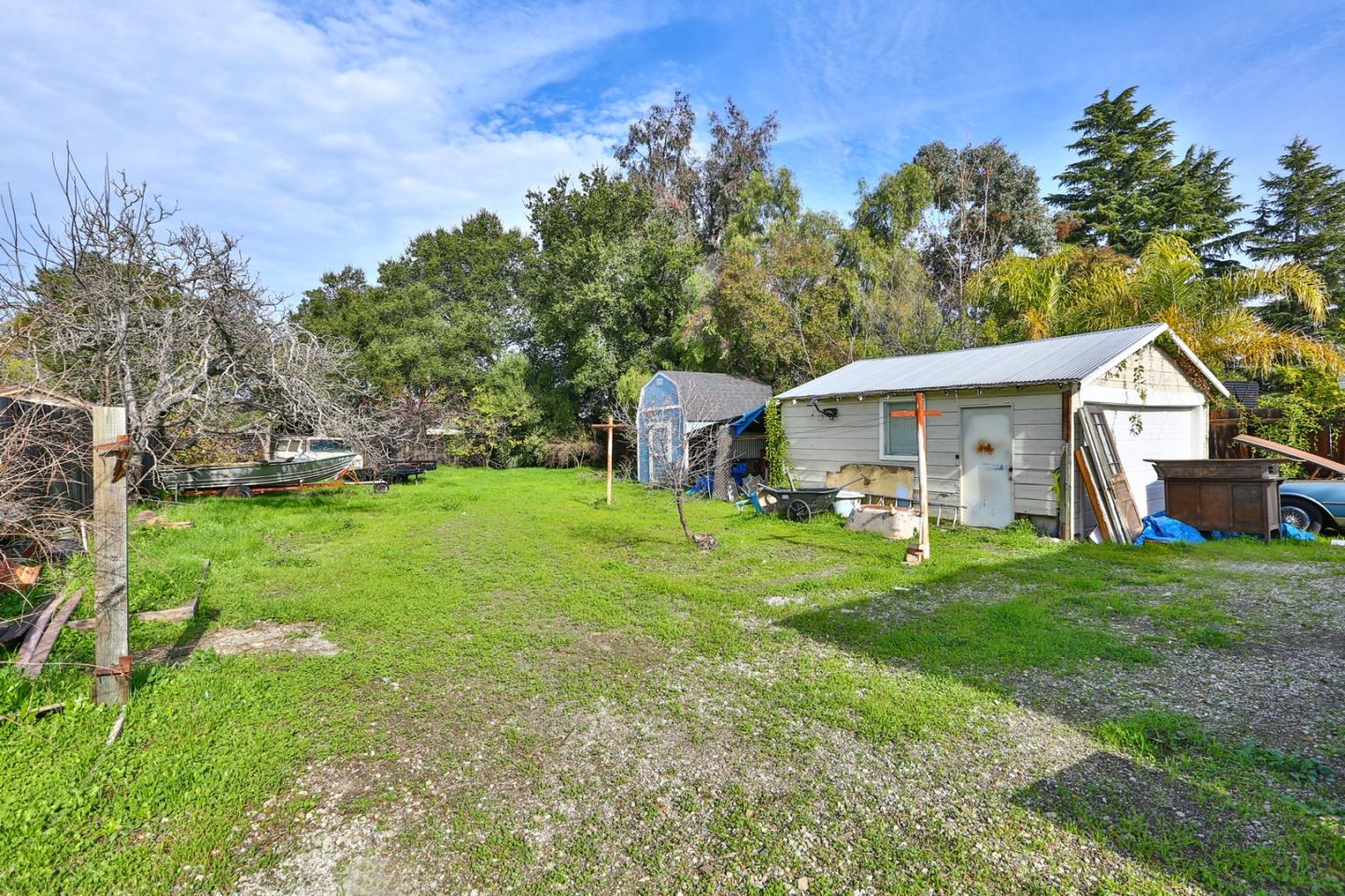 5121 Bucknall Road San Jose, CA 95130 - Photo 10 of 26 a front view of a house with a yard and trees