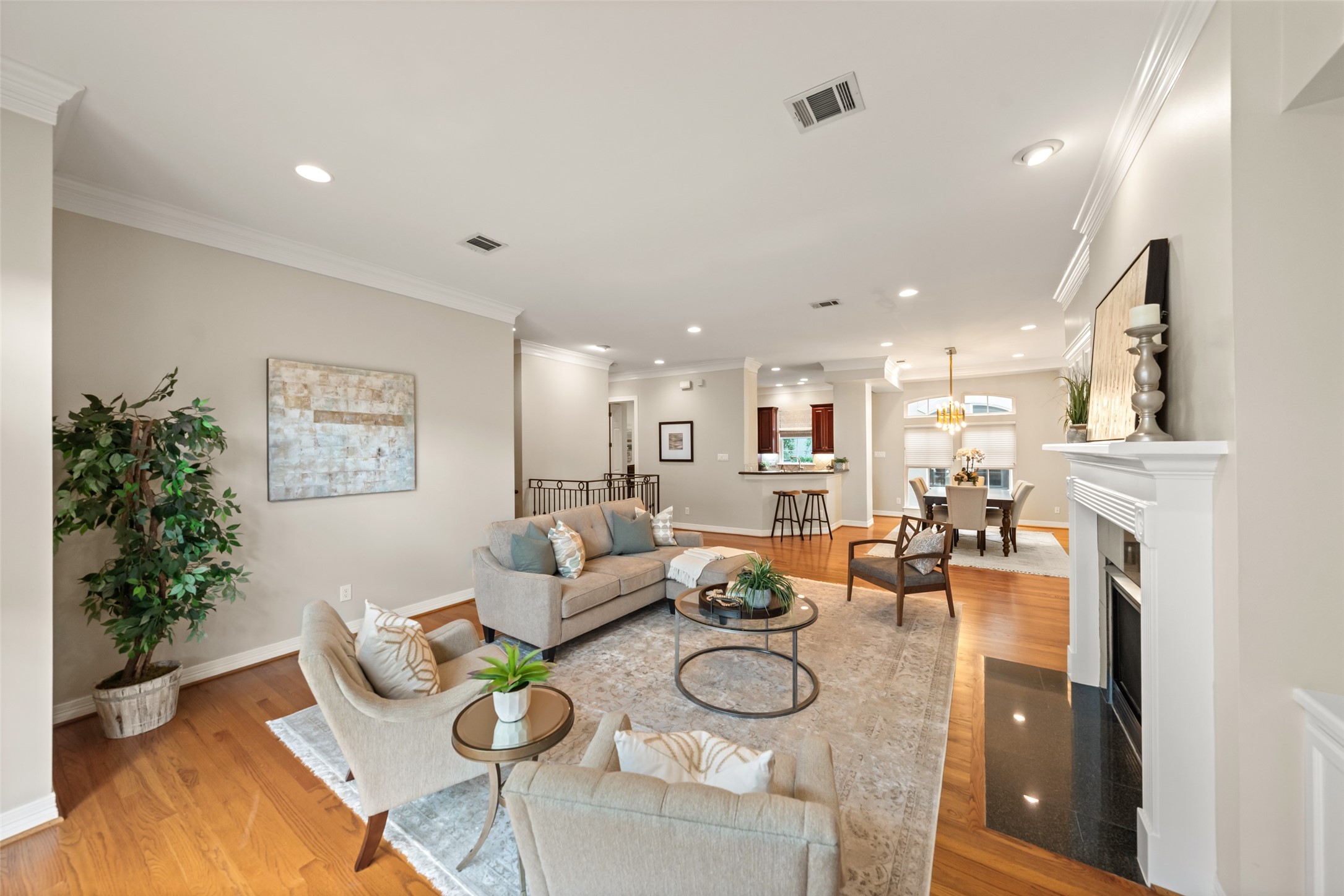 2708 Wroxton Road West University Place, TX 77005 - Photo 22 of 22 This stunning home boasts warm wood floors, high ceilings, elegant crown molding, and an inviting open floor plan.