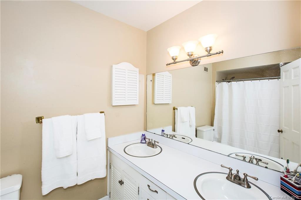 2307 Overhill Road Charlotte, NC 28211 - Photo 15 of 24 a bathroom with a sink and a mirror