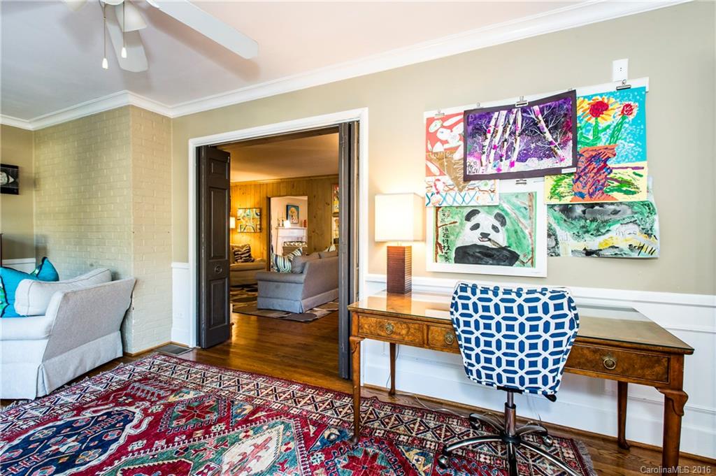 2307 Overhill Road Charlotte, NC 28211 - Photo 23 of 24 a bedroom with a bed and wooden floor