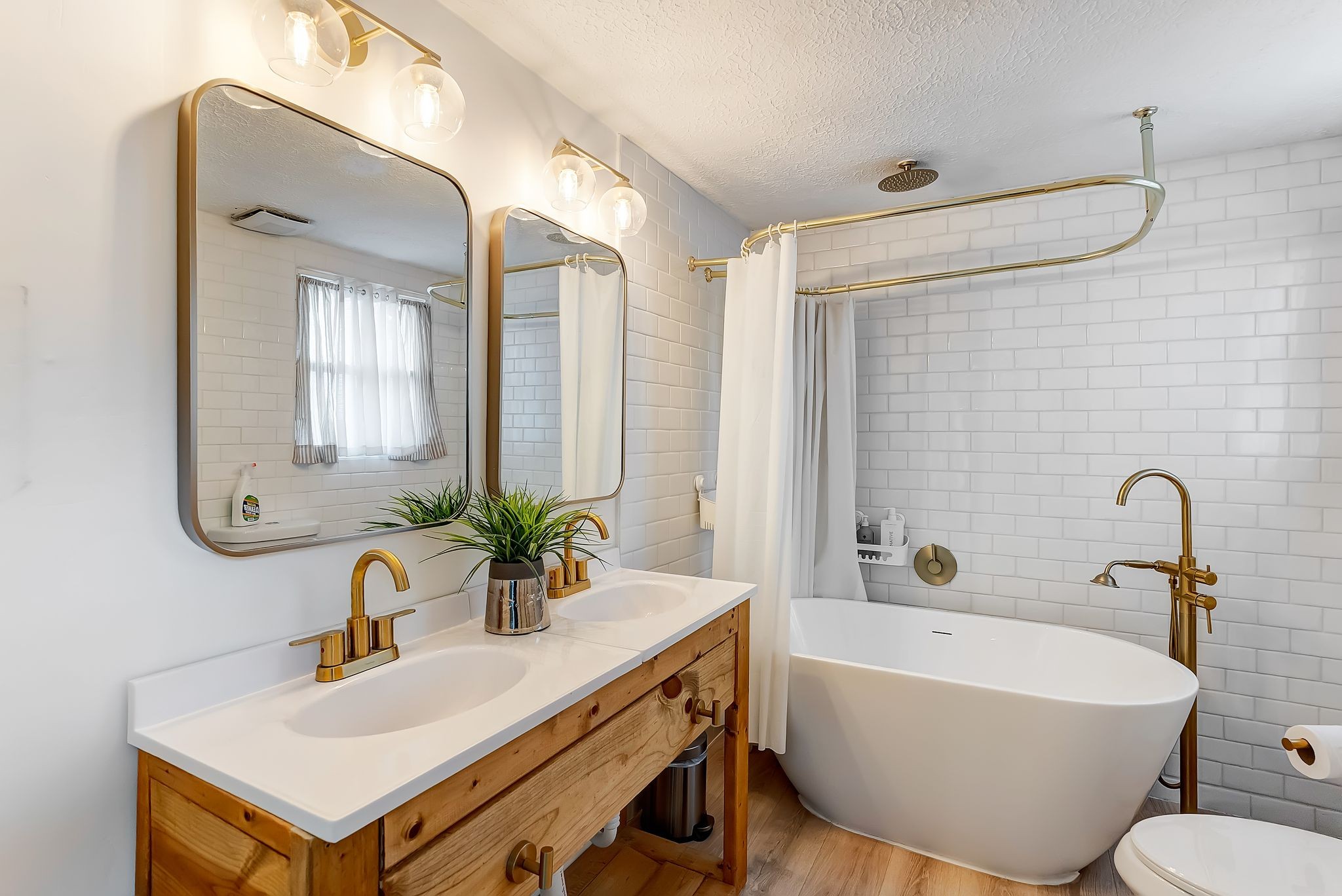 6212 Arno Road Franklin, TN 37064 - Photo 11 of 21 a bathroom with a sink mirror and a bathtub
