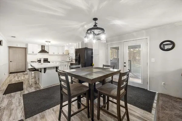 a kitchen with a table and chairs in it