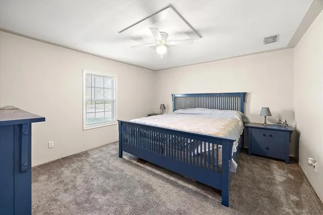 a bed room with a bed and a window