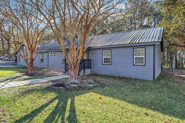 a front view of a house with garden