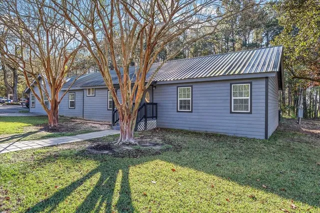 a front view of a house with garden