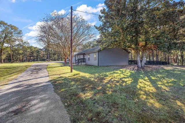 a view of a house with basketball court