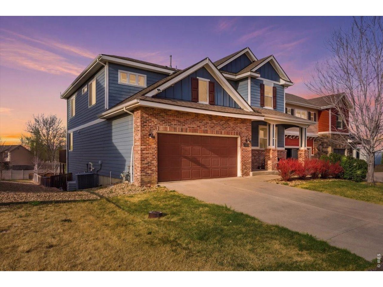 1148 Wagon Bend Road Berthoud, CO 80513 - Photo 2 of 50 a front view of a house with a yard and garage