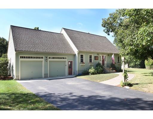 28 McGuire Road Sutton, MA 01590 - Photo 1 of 30 a front view of a house with a garden and yard