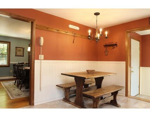 28 McGuire Road Sutton, MA 01590 - Photo 13 of 30 a view of a dining room with furniture and a chandelier
