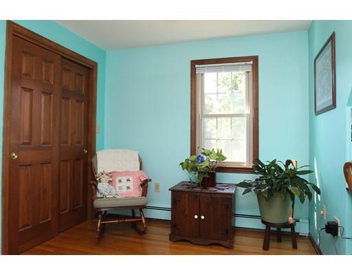 28 McGuire Road Sutton, MA 01590 - Photo 16 of 30 a living room with furniture and a potted plant