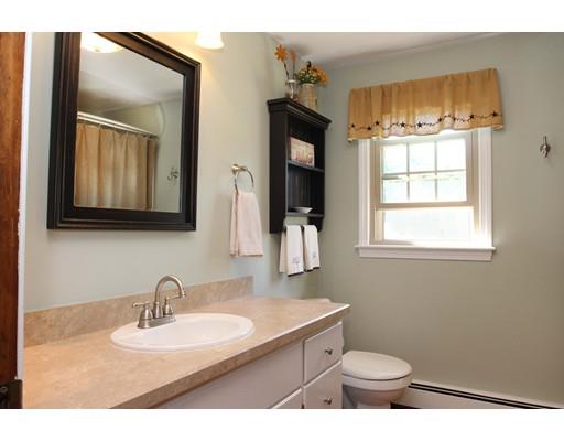 28 McGuire Road Sutton, MA 01590 - Photo 19 of 30 a bathroom with a toilet sink and mirror