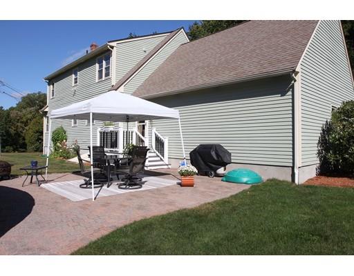 28 McGuire Road Sutton, MA 01590 - Photo 30 of 30 a view of a patio with table and chairs under an umbrella
