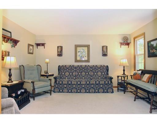 28 McGuire Road Sutton, MA 01590 - Photo 4 of 30 a living room with furniture and a couch