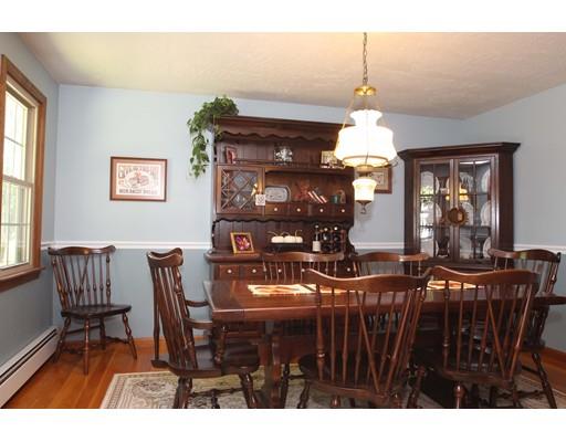 28 McGuire Road Sutton, MA 01590 - Photo 7 of 30 a view of a dining room with furniture and chandelier