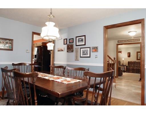 28 McGuire Road Sutton, MA 01590 - Photo 9 of 30 a view of a dining room with furniture and chandelier