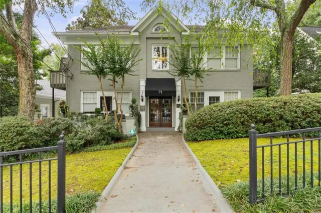 front view of a house with a swimming pool