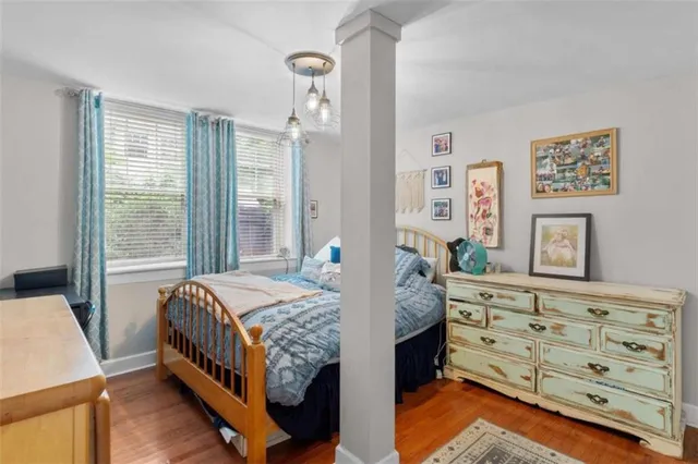 a bedroom with a bed and a dresser