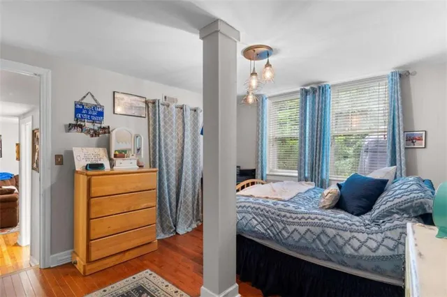 a bedroom with a bed and a dresser