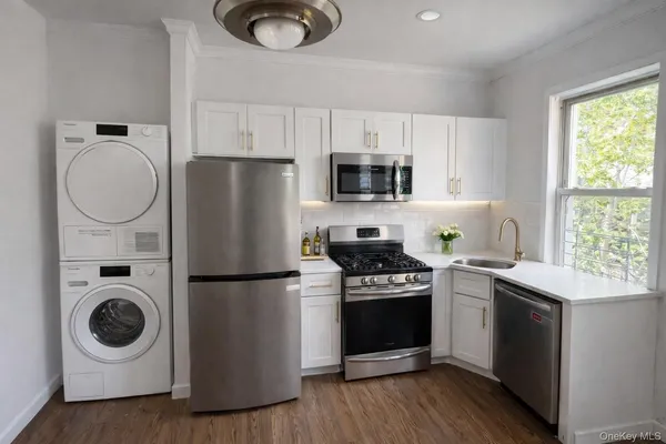 a kitchen with a white stove top oven and refrigerator
