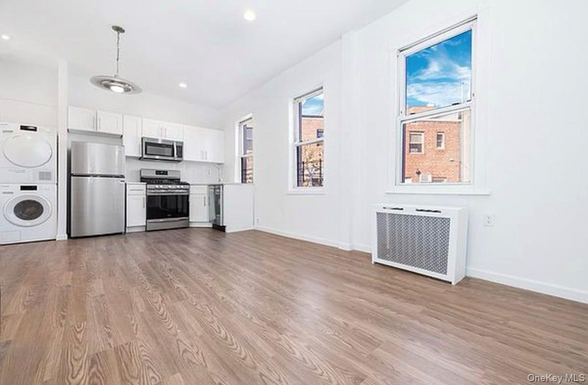 37-17 Greenpoint Avenue, Unit 2 Queens, NY 11101 - Photo 3 of 8 a view of kitchen with sink microwave and refrigerator