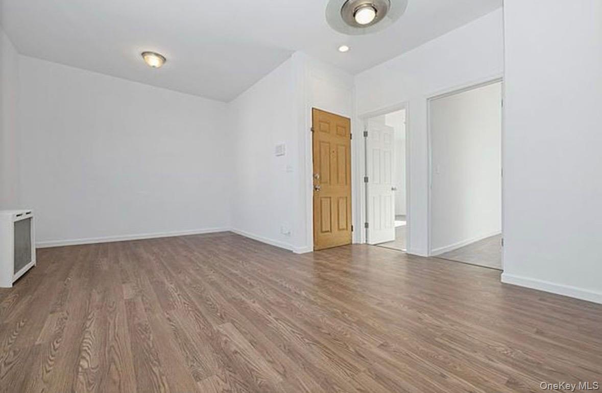 37-17 Greenpoint Avenue, Unit 2 Queens, NY 11101 - Photo 4 of 8 a view of an empty room with wooden floor and a window