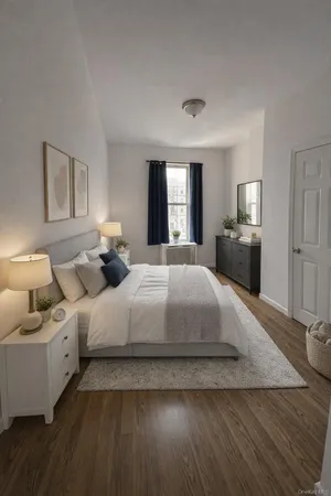 a bedroom with bed and window