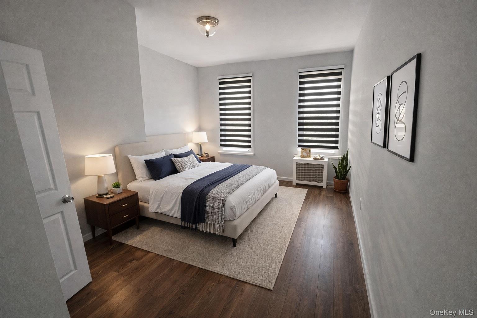37-17 Greenpoint Avenue, Unit 2 Queens, NY 11101 - Photo 6 of 8 a bedroom with a bed and wooden floor
