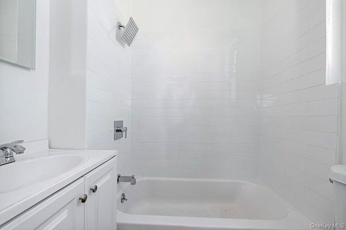 37-17 Greenpoint Avenue, Unit 2 Queens, NY 11101 - Photo 8 of 8 a bathroom with a bathtub and shower