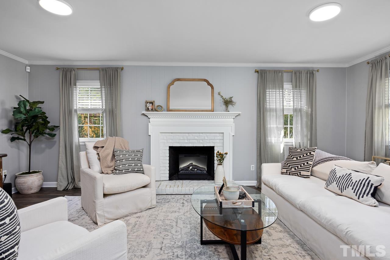 7724 Cart Track Trail Raleigh, NC 27615 - Photo 14 of 28 a living room with furniture and a fireplace