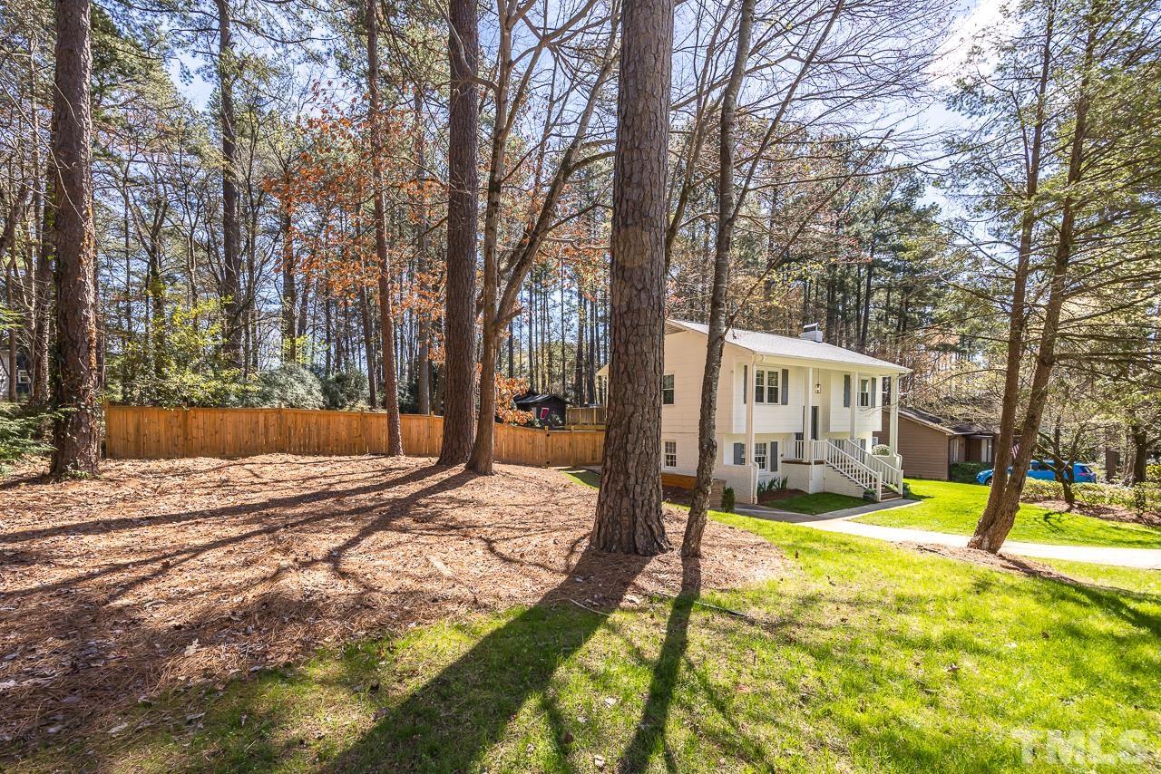 7724 Cart Track Trail Raleigh, NC 27615 - Photo 28 of 28 a view of a house with a yard patio and fire pit