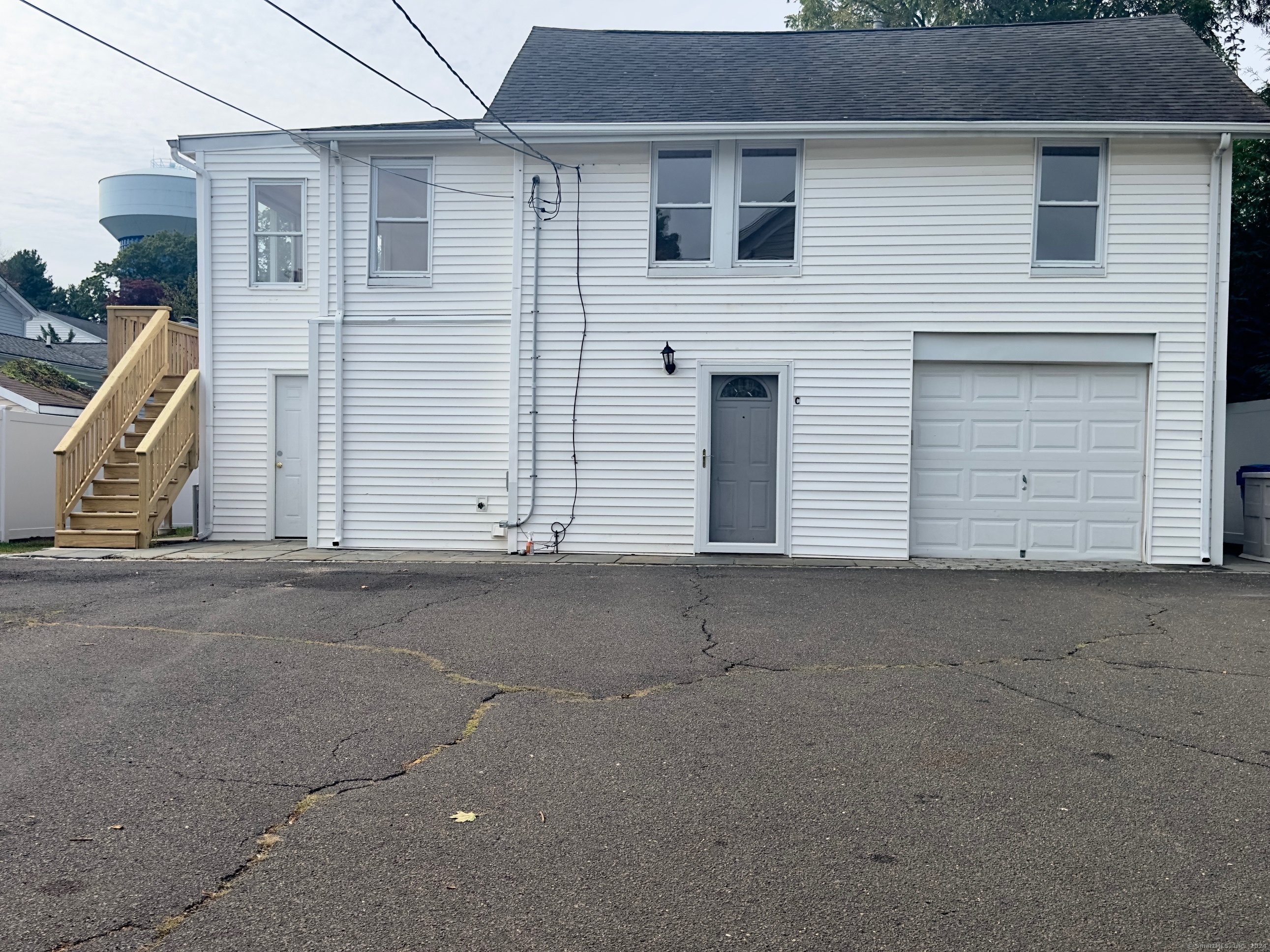 Undisclosed Address Norwalk, CT 06850 - Photo 1 of 1 a view of a house with garage