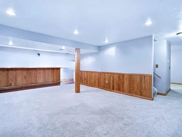 a view of a livingroom with a sink and refrigerator