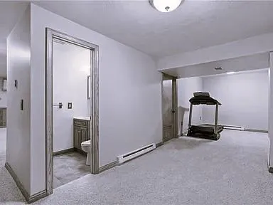 a kitchen with stainless steel appliances granite countertop a sink and a refrigerator