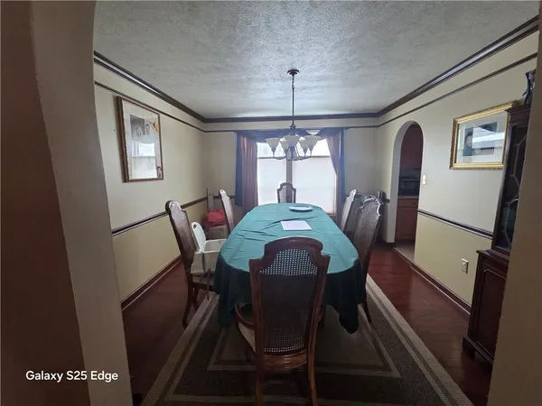 a kitchen with stove and cabinets