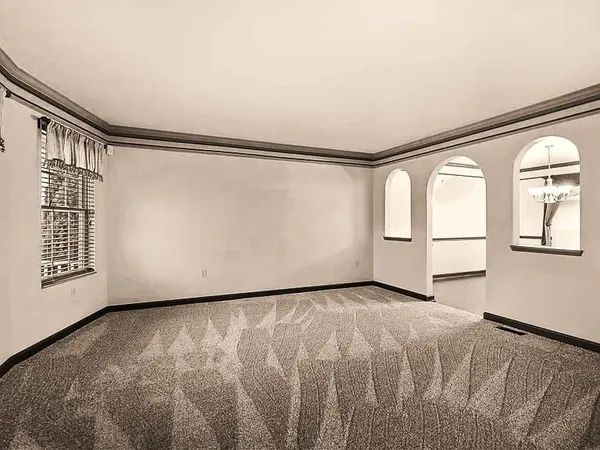 a view of an empty room with a window