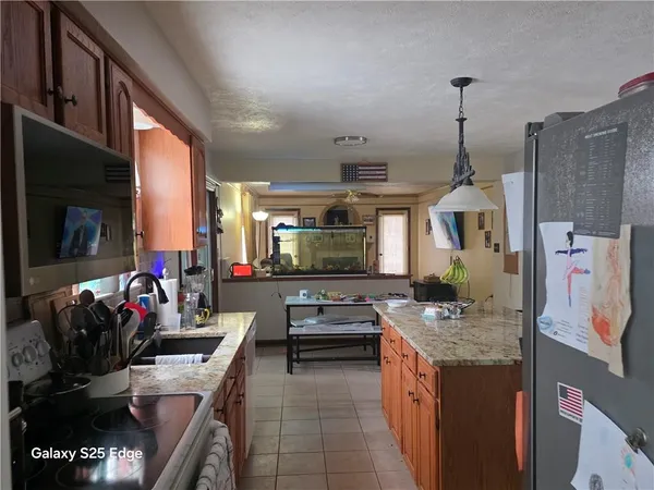 a kitchen with sink a counter and cabinets