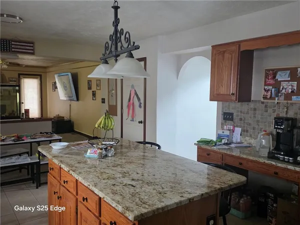a kitchen with a dining table and chairs