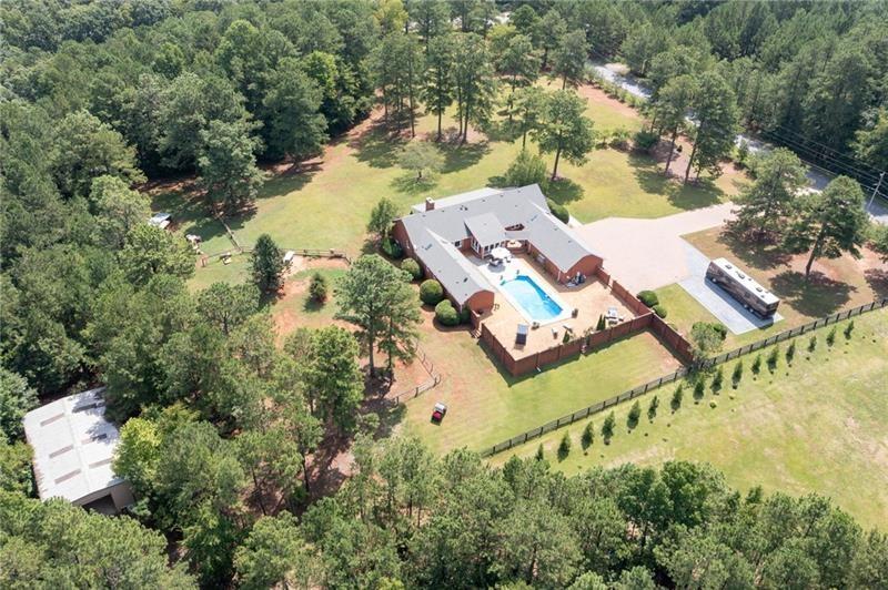 6280 Rutledge Drive Southeast Acworth, GA 30101 - Photo 1 of 1 an aerial view of a house with a lake view