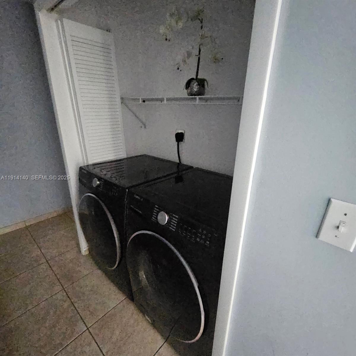 8330 Southwest 96th Place Miami, FL 33173 - Photo 11 of 28 a utility room with dryer and washer