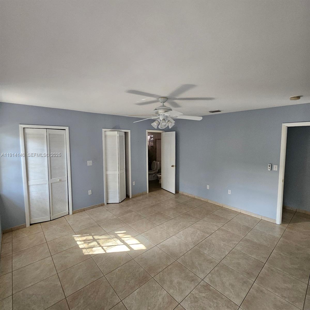 8330 Southwest 96th Place Miami, FL 33173 - Photo 13 of 28 a view of a big room with windows and brick walls