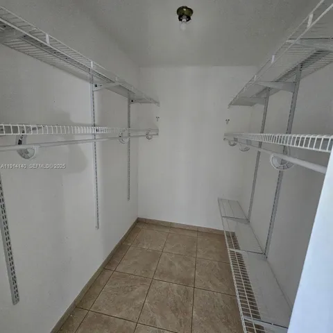 a view of a room with white walls