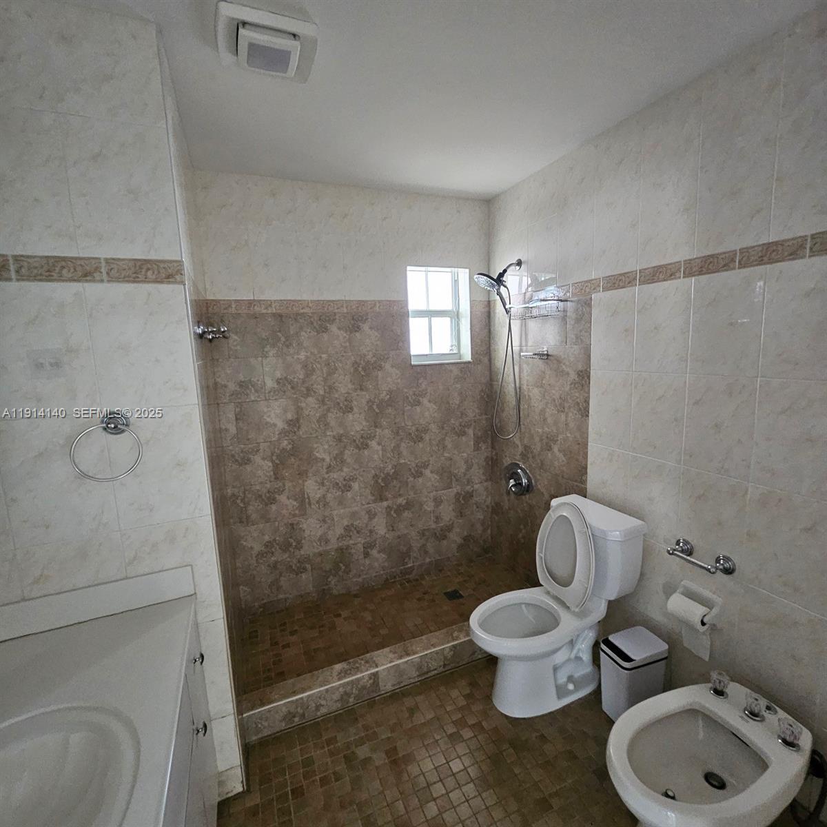 8330 Southwest 96th Place Miami, FL 33173 - Photo 17 of 28 a bathroom with a toilet and a shower