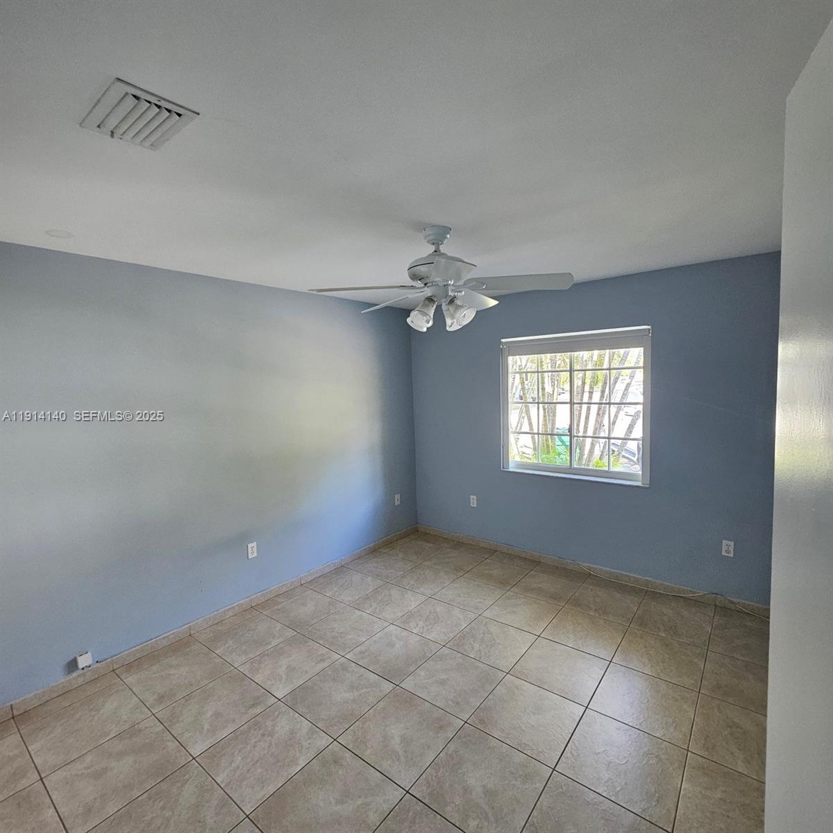 8330 Southwest 96th Place Miami, FL 33173 - Photo 19 of 28 a view of an empty room with a window