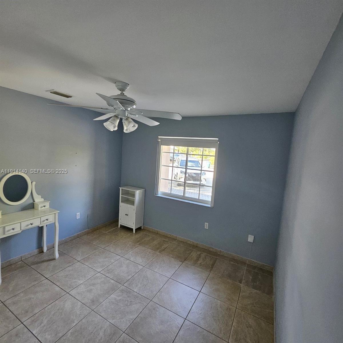 8330 Southwest 96th Place Miami, FL 33173 - Photo 21 of 28 a view of an empty room with a window