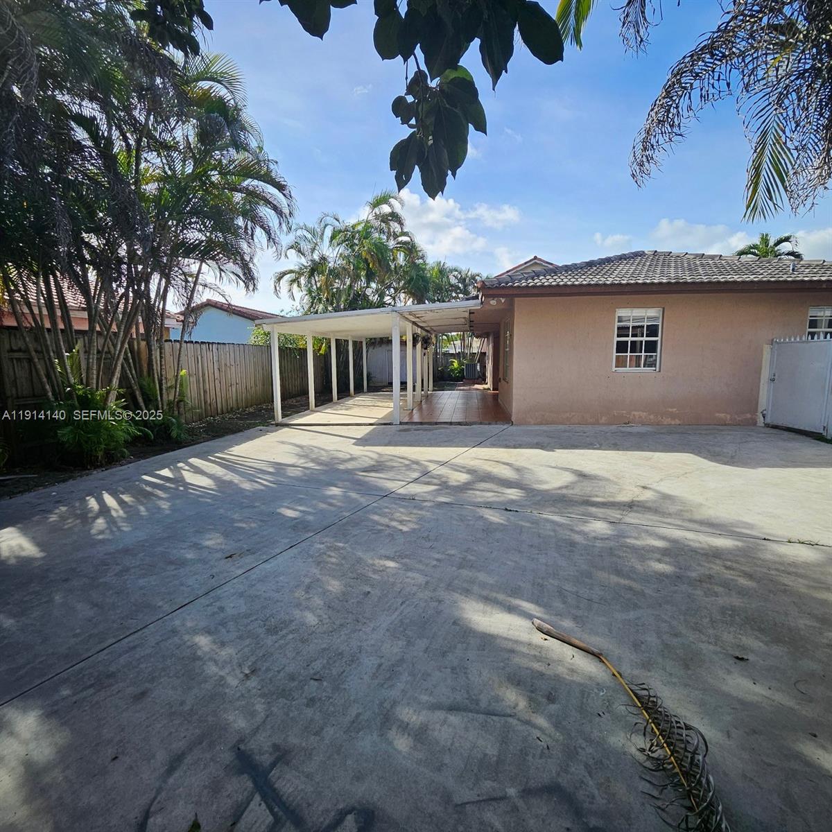 8330 Southwest 96th Place Miami, FL 33173 - Photo 26 of 28 a front view of a house with a yard and garage