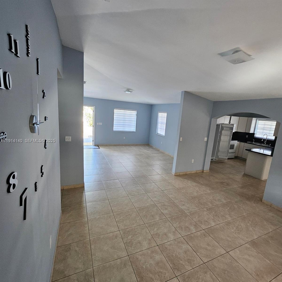 8330 Southwest 96th Place Miami, FL 33173 - Photo 4 of 28 a view of a hallway view with wooden floor and staircase