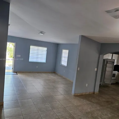 a view of a livingroom with a staircase